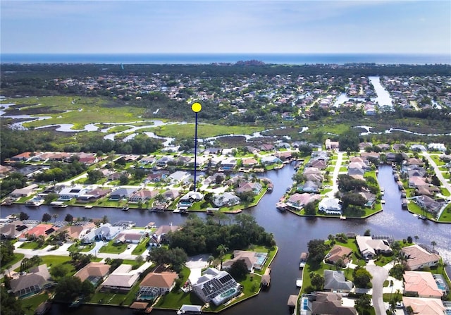 aerial view featuring a water view and a residential view