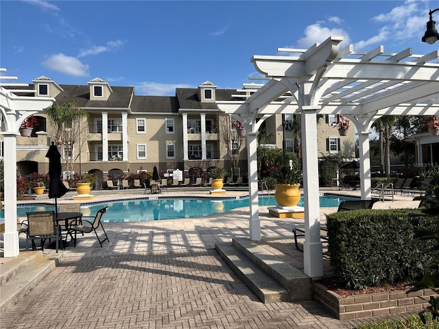 community pool featuring a patio area and a pergola