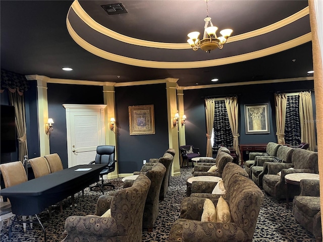 cinema with a tray ceiling, carpet, crown molding, a notable chandelier, and visible vents