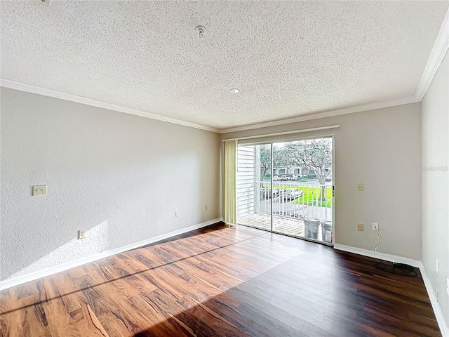 spare room with a textured ceiling, baseboards, dark wood finished floors, and crown molding