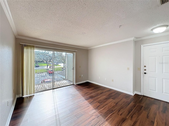 unfurnished room with dark wood-style floors, visible vents, crown molding, and baseboards