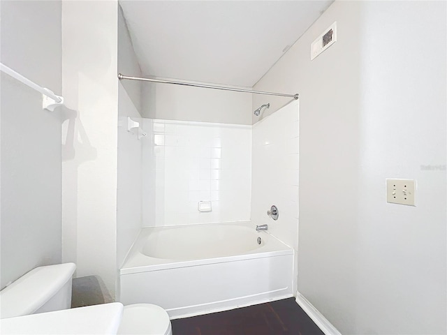 full bath featuring shower / bath combination, baseboards, visible vents, toilet, and wood finished floors