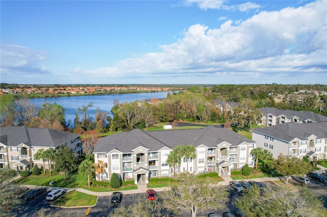 bird's eye view with a water view and a residential view