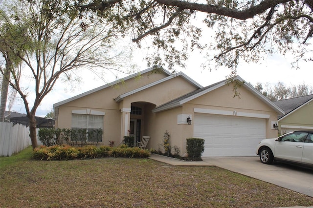 single story home with driveway, an attached garage, fence, a front lawn, and stucco siding