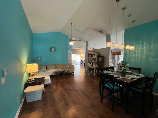 dining area featuring baseboards, visible vents, lofted ceiling, ceiling fan, and wood finished floors