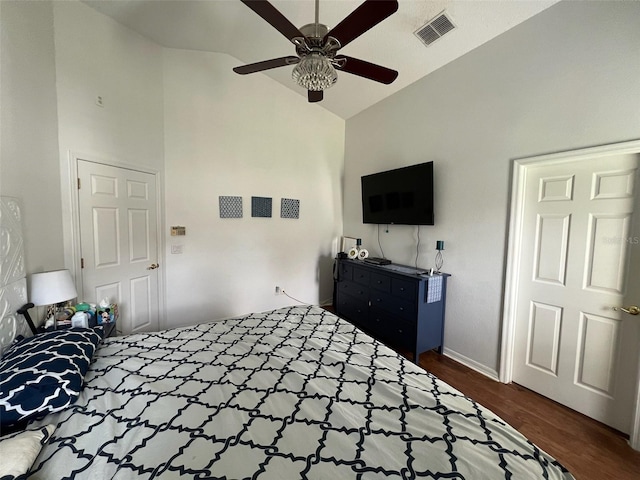 bedroom featuring high vaulted ceiling, ceiling fan, visible vents, and dark wood-type flooring