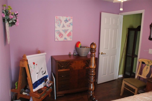 bedroom with dark wood-style floors