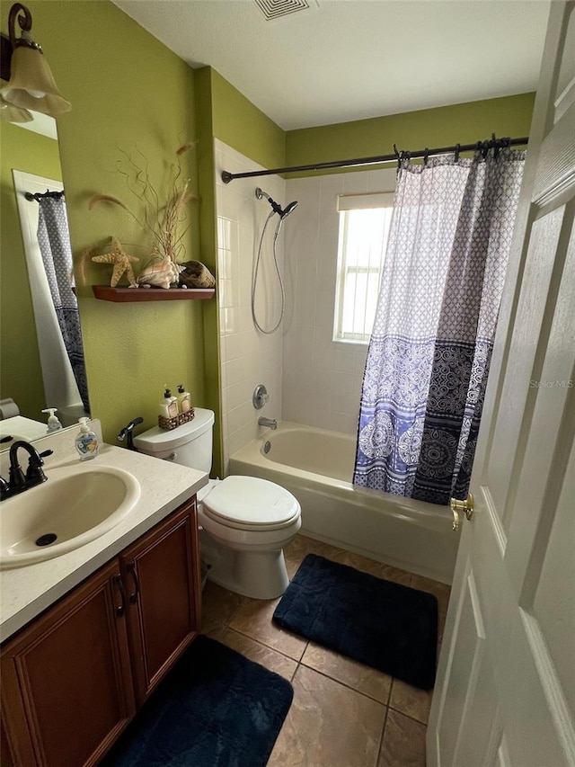 bathroom with shower / bath combo, visible vents, toilet, tile patterned flooring, and vanity