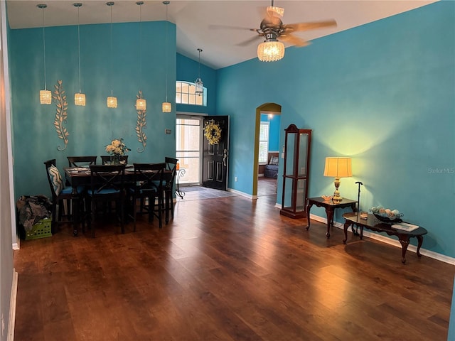 536 Dunoon St, Ocoee, FL 34761 - dining area with arched walkways, wood finished floors, ceiling fan, and high vaulted ceiling