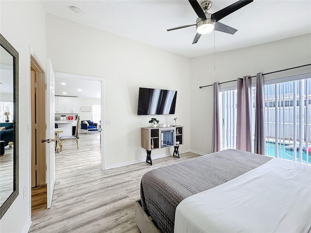 bedroom with light wood finished floors, a ceiling fan, a textured ceiling, access to outside, and baseboards