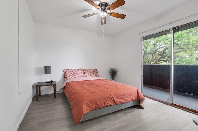 bedroom with access to outside, baseboards, ceiling fan, and wood finished floors