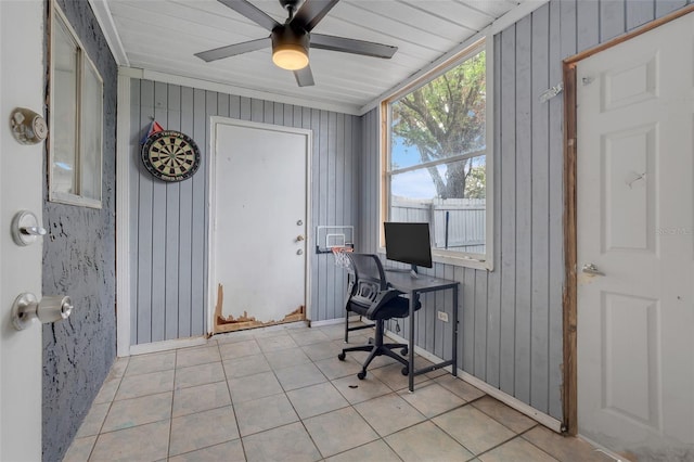 office space with a ceiling fan and light tile patterned flooring