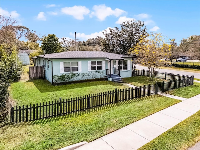 view of front facade with a fenced front yard and a front yard