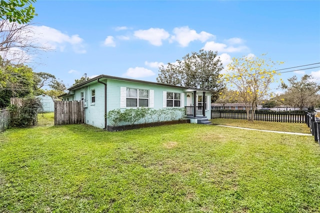 exterior space with fence private yard and a front yard