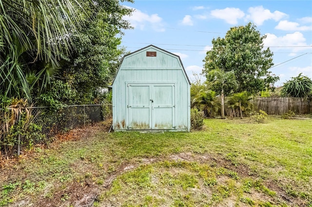 view of shed with fence private yard