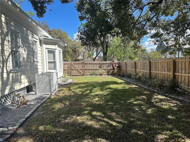 view of yard with a fenced backyard