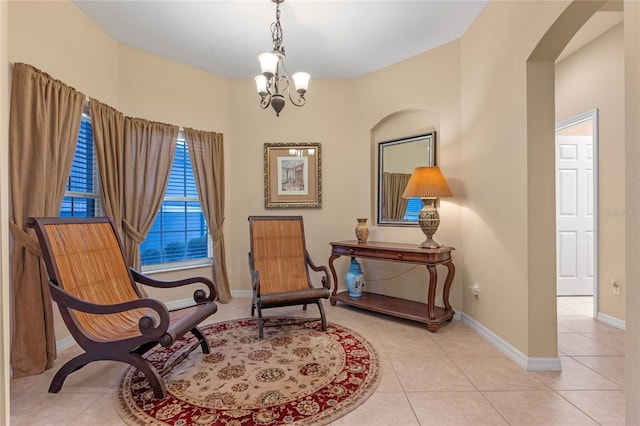 1562 Travertine Ter, Sanford, FL 32771 - sitting room with light tile patterned floors, a chandelier, arched walkways, and baseboards