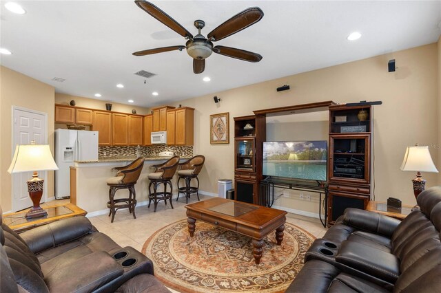 1562 Travertine Ter, Sanford, FL 32771 - living room featuring light tile patterned floors, visible vents, a ceiling fan, and recessed lighting
