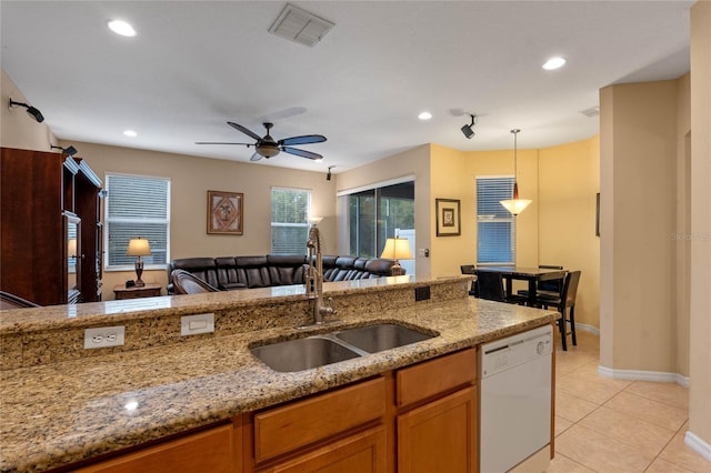 1562 Travertine Ter, Sanford, FL 32771 - kitchen with light stone counters, decorative light fixtures, visible vents, open floor plan, and dishwasher