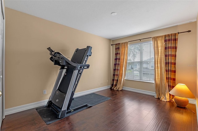 1562 Travertine Ter, Sanford, FL 32771 - exercise area featuring baseboards and dark wood finished floors