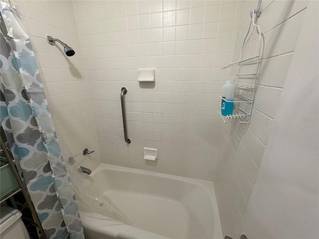 bathroom with shower / bath combo