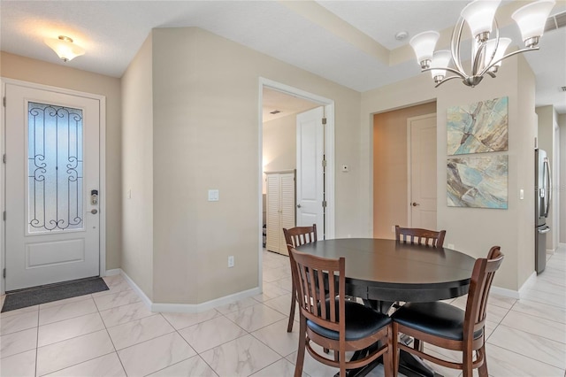 dining area featuring baseboards