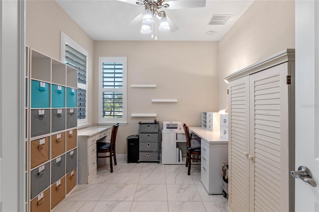 office area with marble finish floor, ceiling fan, and visible vents