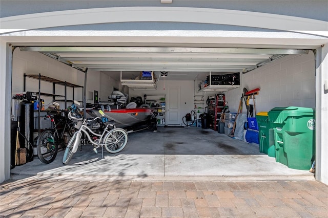 garage with concrete block wall