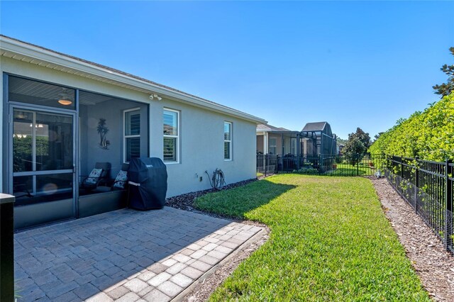 view of yard with a patio area and a fenced backyard