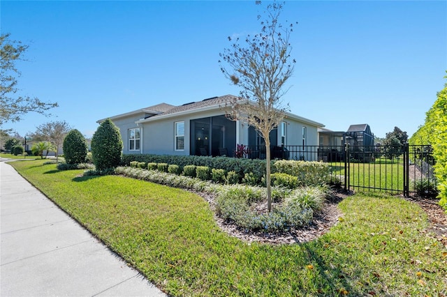 view of home's exterior featuring a lawn, fence, and stucco siding