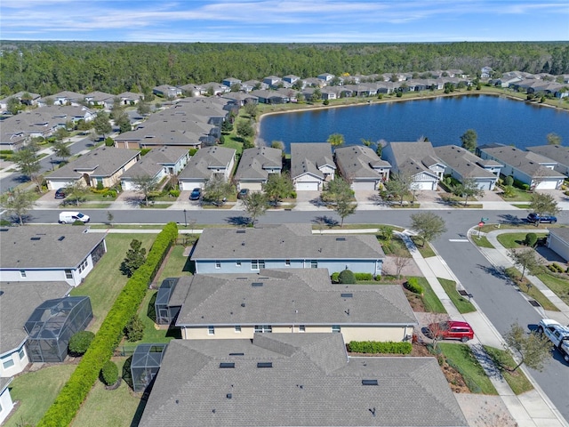 birds eye view of property with a residential view and a water view