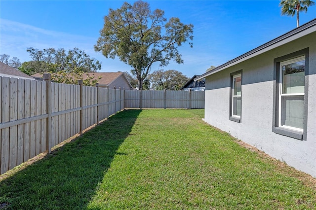 view of yard featuring a fenced backyard