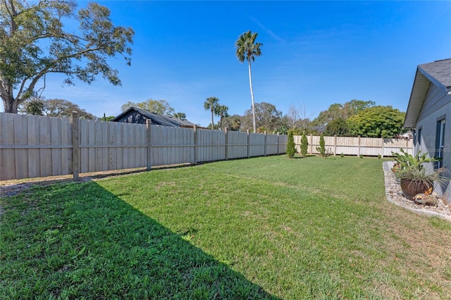 view of yard featuring a fenced backyard