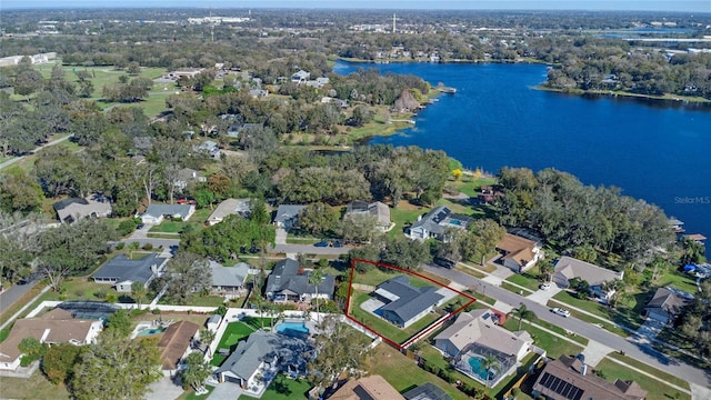 birds eye view of property featuring a water view and a residential view