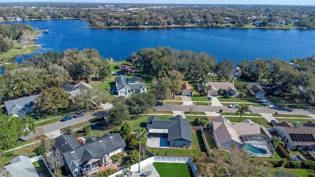 birds eye view of property with a residential view and a water view