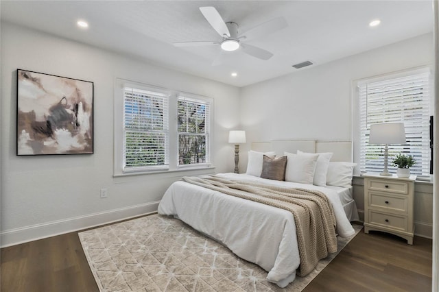 bedroom with baseboards, visible vents, a ceiling fan, wood finished floors, and recessed lighting