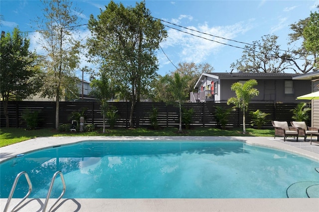 view of swimming pool featuring a fenced backyard and a fenced in pool