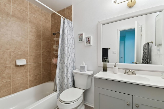 full bathroom featuring toilet, shower / bath combo with shower curtain, and vanity