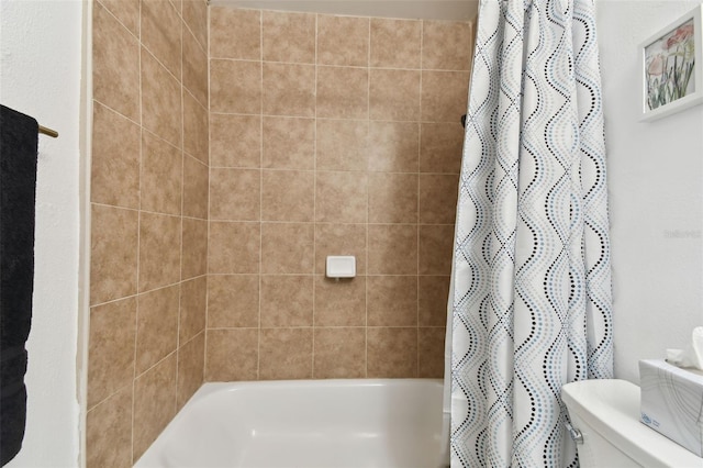 bathroom with shower / tub combo with curtain and toilet