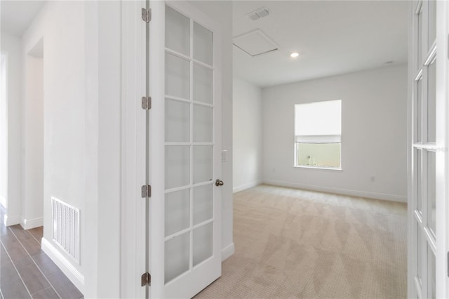 corridor featuring attic access, recessed lighting, baseboards, and visible vents