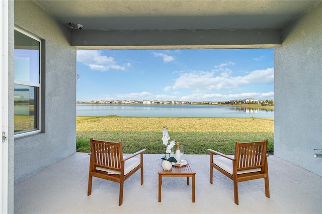 view of patio / terrace featuring a water view