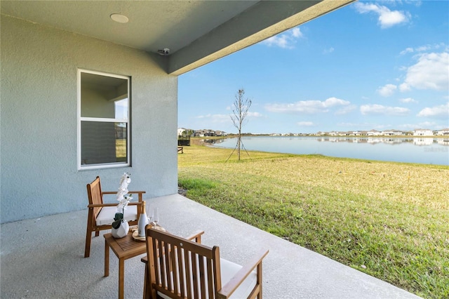 view of patio / terrace with a water view