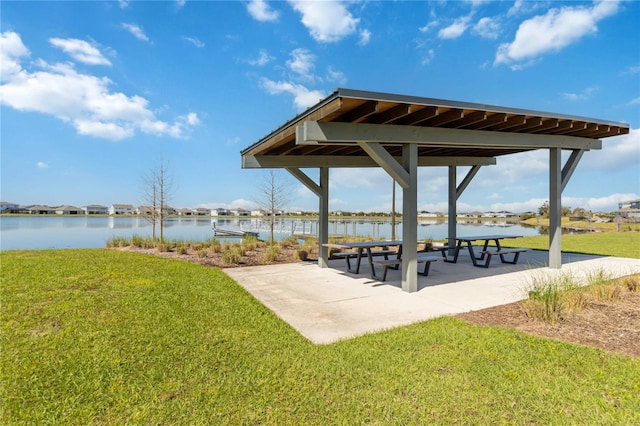 view of home's community with a gazebo, a lawn, and a water view