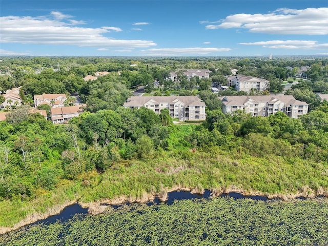 drone / aerial view with a water view and a residential view