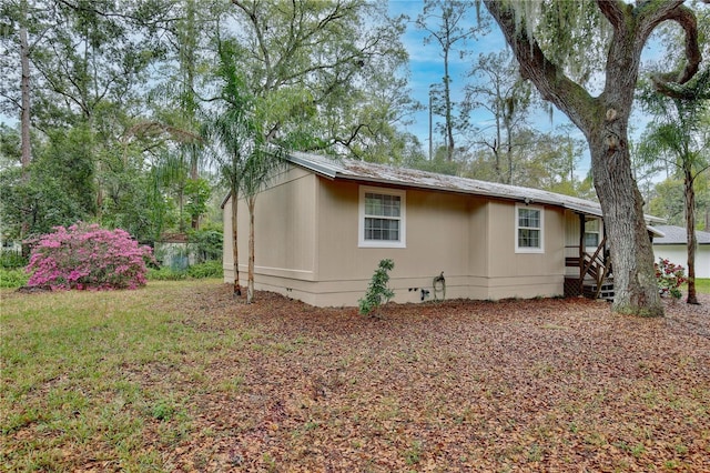 view of side of property featuring crawl space