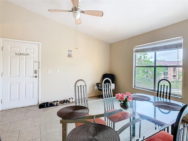 dining room featuring vaulted ceiling, ceiling fan, and light tile patterned floors