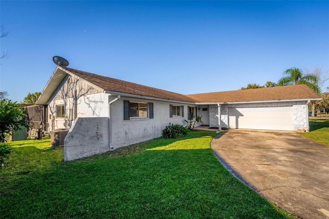 view of front of house featuring central AC unit, a garage, concrete driveway, stucco siding, and a front lawn