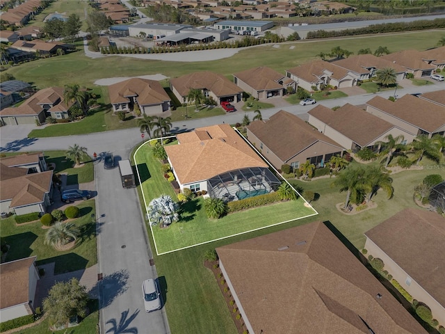 birds eye view of property featuring view of golf course and a residential view