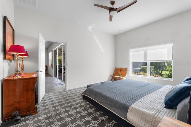 bedroom with ceiling fan, visible vents, and baseboards