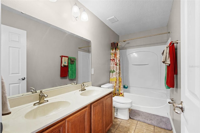 full bath featuring visible vents, a sink, a textured ceiling, and tile patterned floors